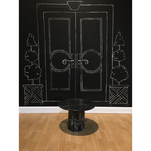 Round, modern style ,black and white marble table with base. This heavy marble table will be a great accent to add to any...