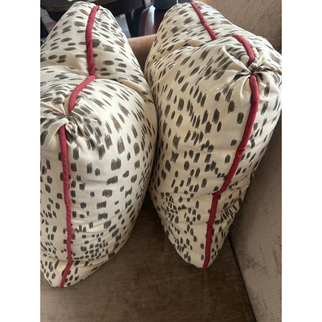 A large pair of chic with red piping Brown on Cream throw pillows. Feather/ down Inserts in one pillow and a synthetic...