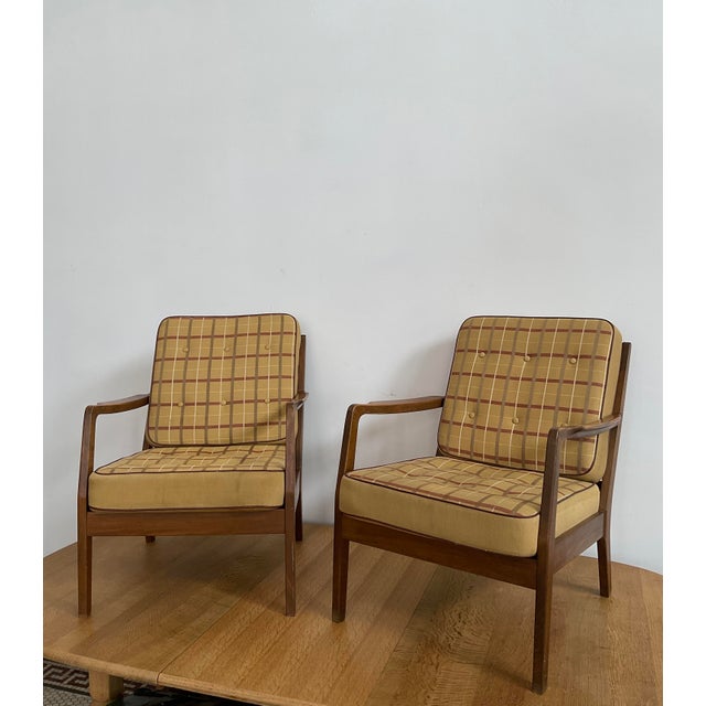 Bring the pinnacle of Danish Modernism into your home with this exceptional pair of armchairs possibly by the legendary...