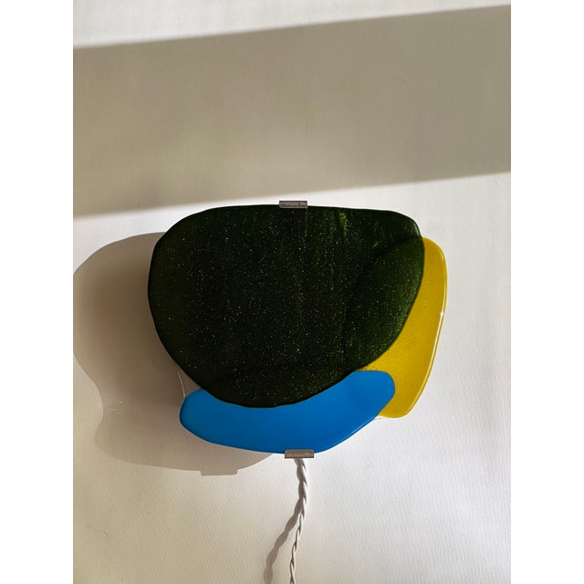 Handcrafted glass wall light handcrafted wall light born from the desire to blend light with the vibrant colors of...