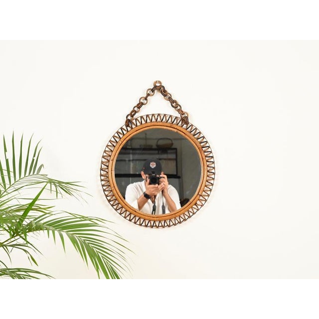 Delightful Mid-Century organic round mirror with an adjustable chain, fully handmade in curved rattan, hand-woven wicker,...