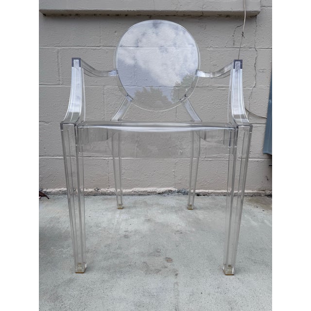 An authentic Kartell Louis Ghost Armchair by Philippe Starck — confirmed via molded maker's marks on the underside. One of...