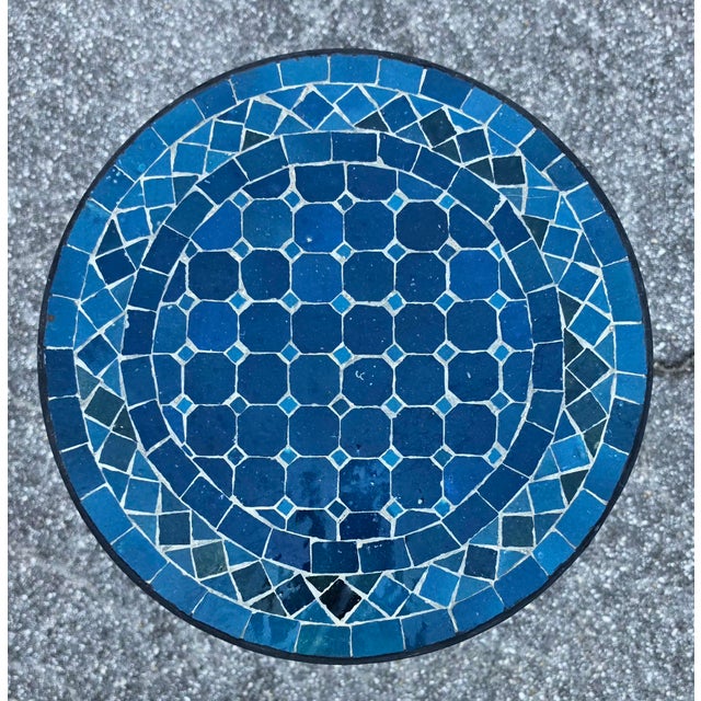 Add a pop of color and handcrafted charm to your home or patio with this beautiful petrol blue mosaic accent table....