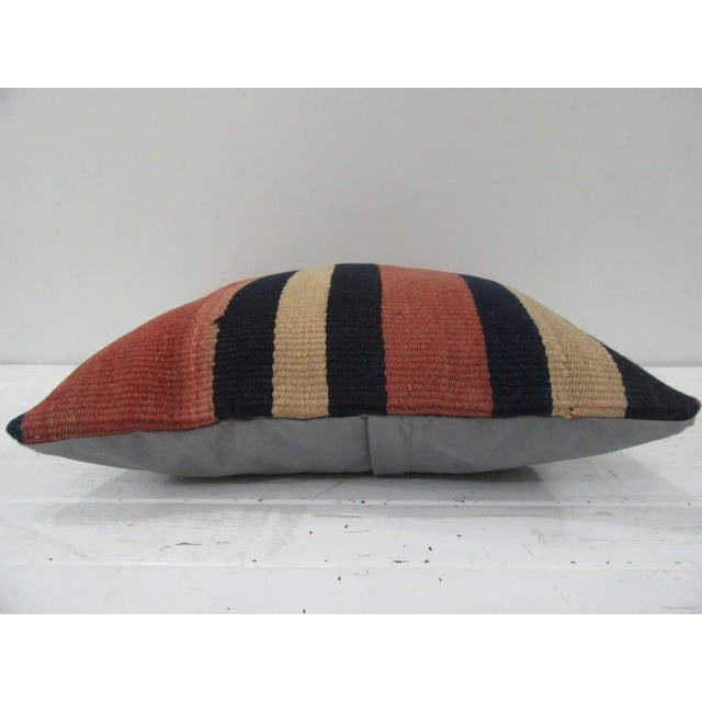 This is a pillow cover made from a vintage kilim rug. The piece was properly washed and ready to use. Pillow inserts not...