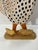 This carved wood chicken & chicks is hand painted. The tail is attached to the body by string This is carved pine