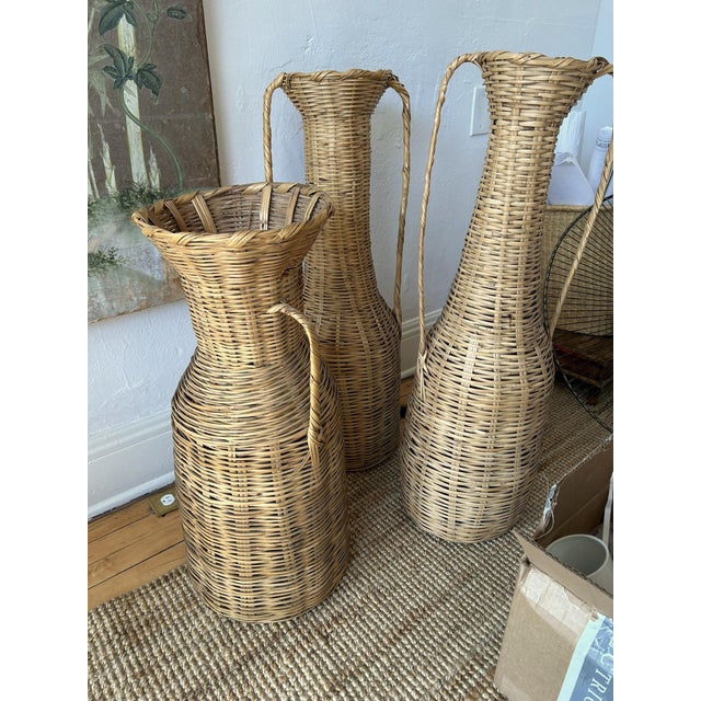 Set of 3 tall baskets with dramatic proportions and handles - reminiscent of a Greek amphora urn. Two (2) taller baskets...