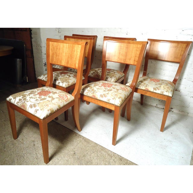 Sleek set of six mid-century modern dining chairs featuring uniquely designed upholstered cushions. (Please confirm item...
