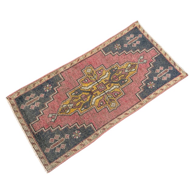 Welcome to our curated collection of authentic Anatolian textiles. This stunning vintage Tashpinar small rug is a...