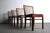 A vibrant set of 4 Mid Century Danish Modern walnut dining chairs. This set of walnut side chairs is vibrant and in near...
