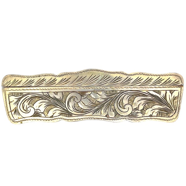 Silver Comb box adorned with intricate enamel work. The lid features a pastoral scene with figures in period attire, set...