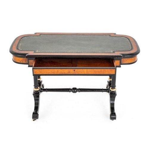 Good Quality Burr Walnut and Ebonised Writing Table. This Wonderful Writing Table is Raised Upon Turned Columns with Swept...