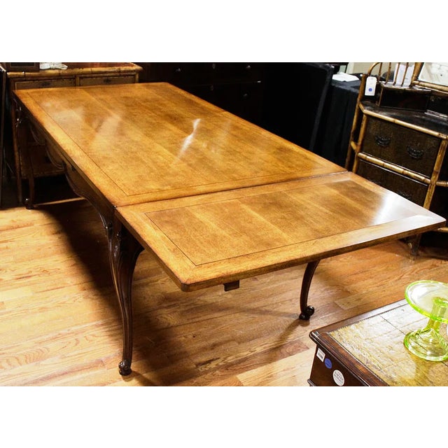 The product is a handmade, French-style drawer leaf dining or kitchen table with a rectangular shape. It has a height of...