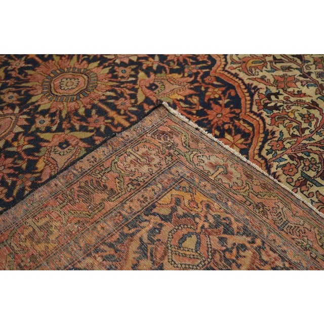 This is a “Mishan”, i.e. urban style, west Persian Malayer, in the Farahan-Sarouk style with a palmette pendanted navy...