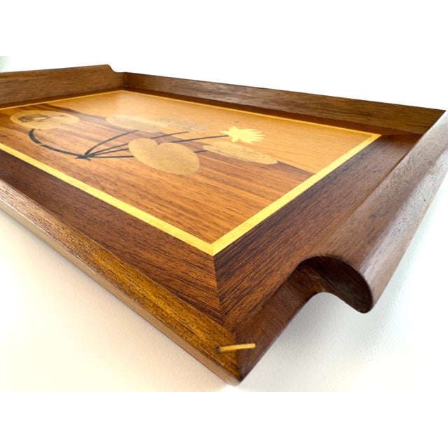 A beautifully crafted vintage serving tray featuring an intricate pictorial marquetry scene of a frog resting among lily...