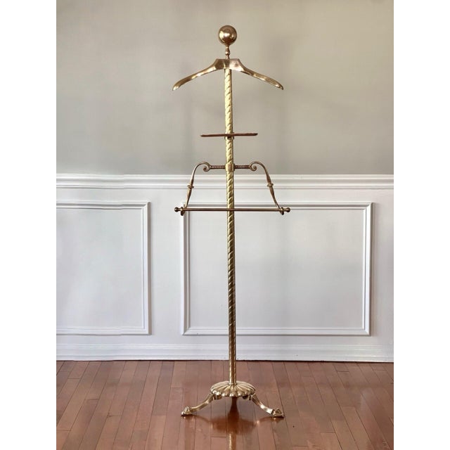 Midcentury sculptural solid brass clothing valet with adjustable trouser rack and cufflink tray. A rope twist central...