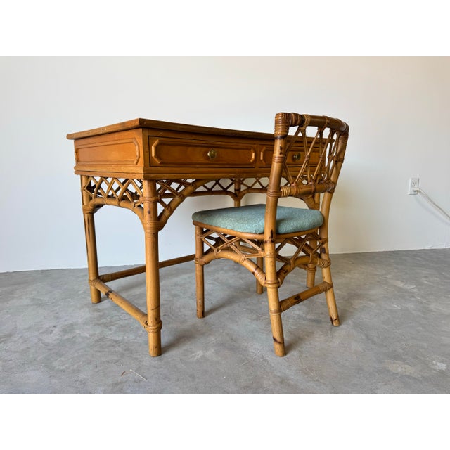 Add a touch of coastal elegance to your space with this vintage Ficks Reed faux bamboo rattan desk and chair set. Designed...