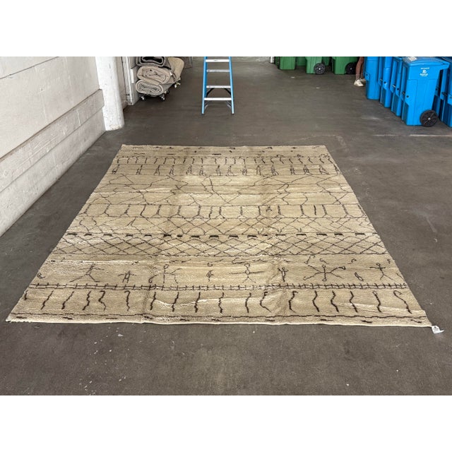 Design Plus Gallery presents a Moroccan/Beni Ourain–Style Area Rug. This wool rug showcases an ivory and gray field...