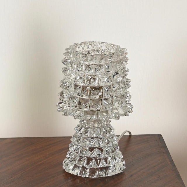 Spectacular and very rare murano glass table lamp entirely crafted in rostrato mouth-blown murano glass. This incredibly...