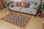 This stunning hand-knotted Afghan Balouchi rug is a captivating addition to any decor. Crafted by skilled artisans, it...