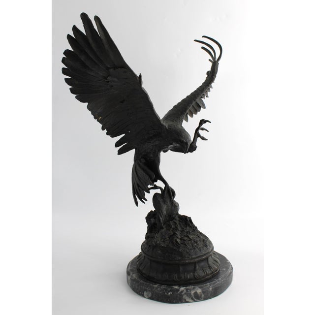 This is a gorgeous antique bronze sculpture of an attacking eagle or falcon by French artist Jules Moigniez (1835-1894)....