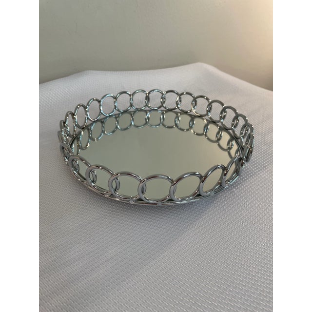 A chic Mirrored Chrome Art Deco style gallery barware or dresser tray with a gallery of overlapping geometric circles....