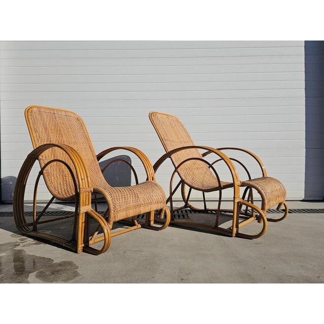 A pair of absolutely stunning Mid Century Modern bamboo and rattan loungers. Their stunning design makes these loungers a...