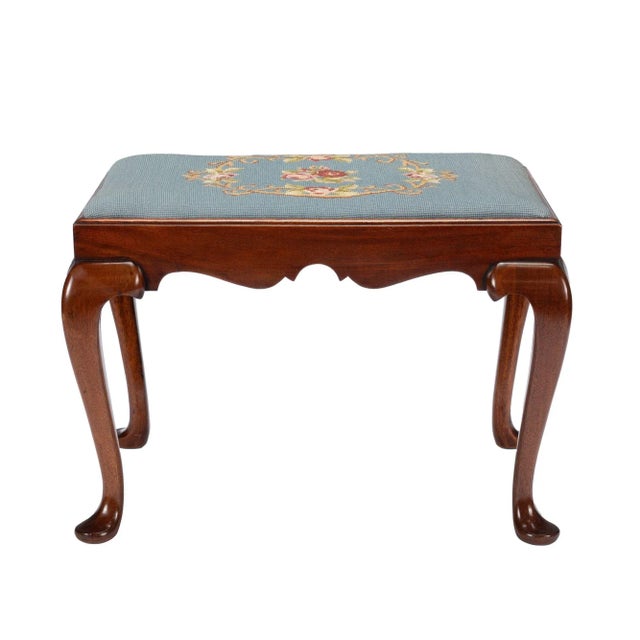 Academic Revival Queen Anne style mahogany bench/stool with upholstered slip seat seat. The cabriole legs flow in a...