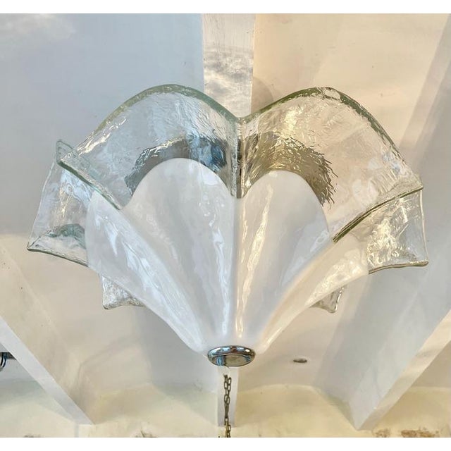 Exceptional Mazzega chandelier oversized white glass Murano with metal structure. The Design and the quality of the white...