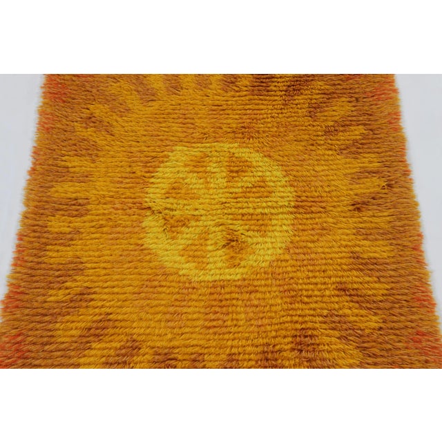 Hand-knotted in lush, high-pile wool in Sweden circa 1960-1970, this 2x4 vintage Swedish Rya rug is a bold new addition to...