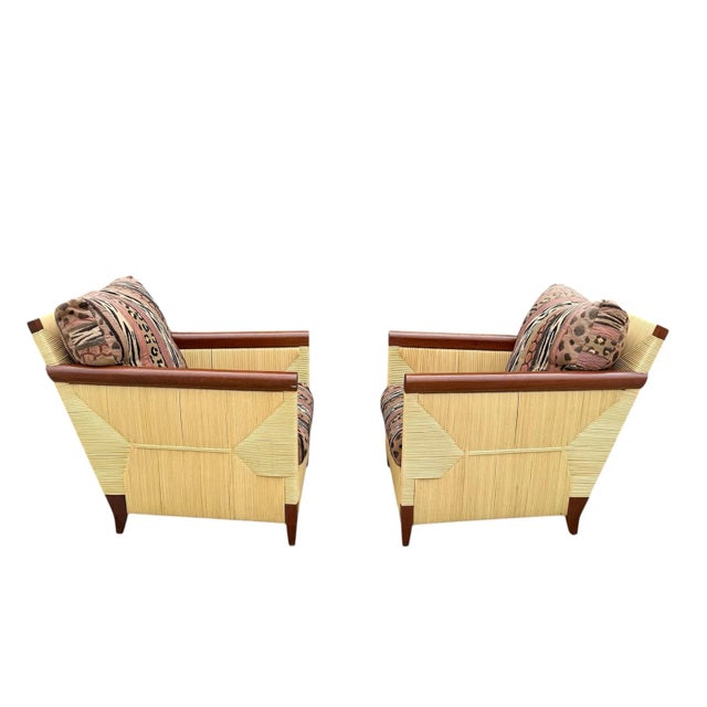 A pair of lounge chairs by John Hutton for Donghia, circa 1994. From the limited Merbau collection, these chairs were...