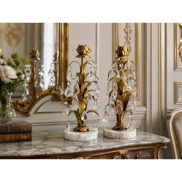 A pair of gorgeous Mid-Century Italian tole gilt floral candlesticks accented with beautiful crystals on marble bases,...