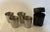 A vintage USSR portable 4-piece nesting vodka shot cup set, presented in its original black zip travel case adorned with...