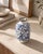 This blue and white crackle glaze vase brings a collected, decorative feel to a shelf, console, or tabletop. Its compact...