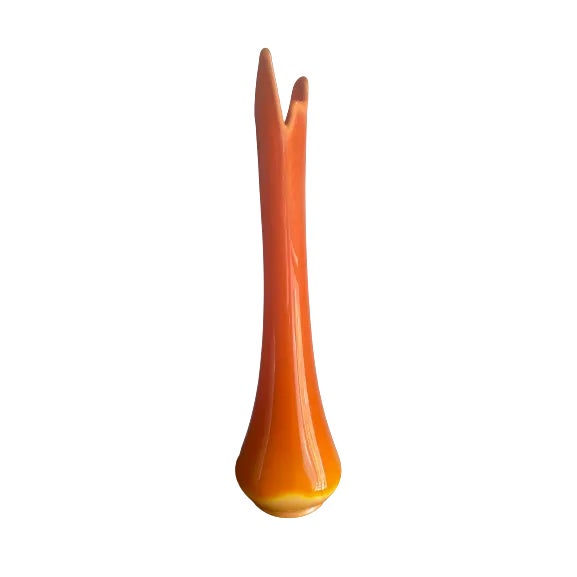 Finish your space with this other-worldly slag glass vase. Eyes will be drawn to this pop of orange embellishing your room.