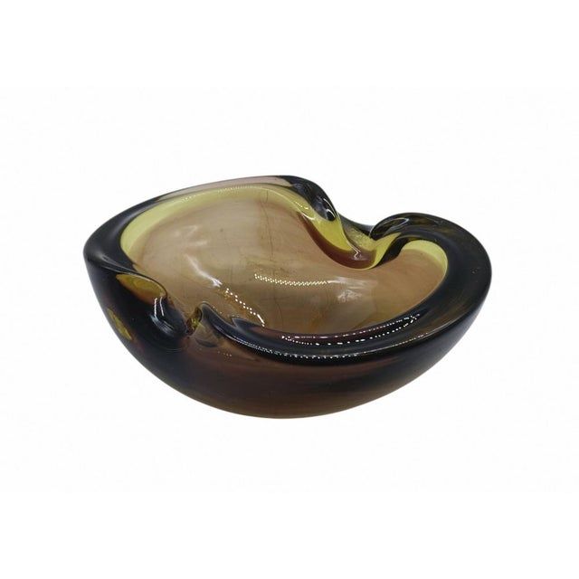 Murano glass bowl made using the Sommerso technique with a fantastic organic shape. The bowl has a free-form, sculptural...