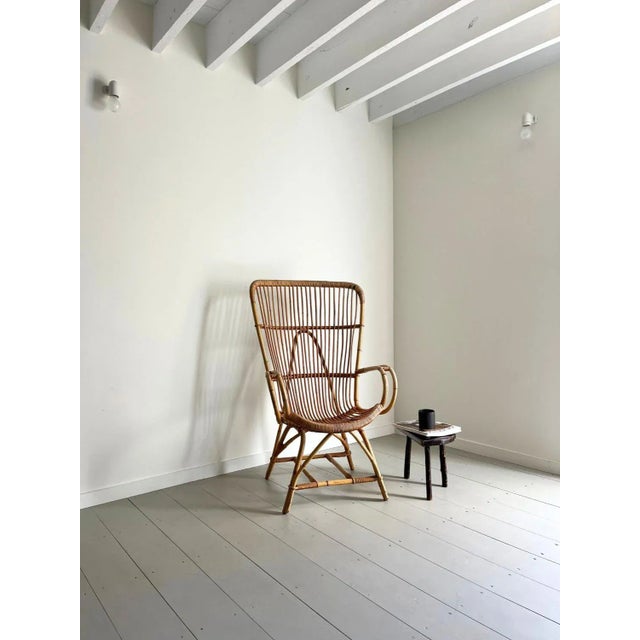 An original Mid Century bamboo armchair. This rattan lounge chair dates from 1950s Italy and has a beautiful sculptural...