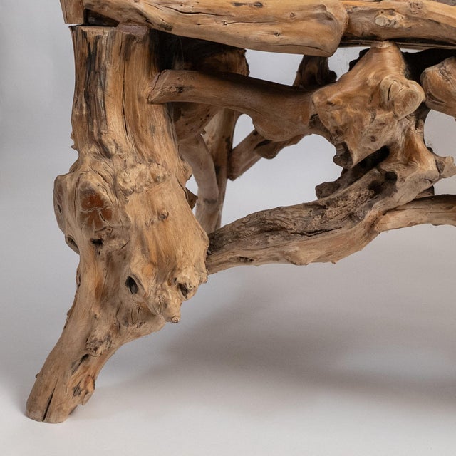 A striking American Folk Art twig bench crafted from natural hickory branches, dating to circa 1920. This sculptural bench...