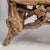 A striking American Folk Art twig bench crafted from natural hickory branches, dating to circa 1920. This sculptural bench...