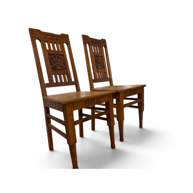 Infuse your dining space with historic, global charm with this handsome pair of vintage Dutch Colonial style chairs....