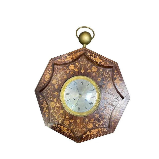 A french rosewood and boxwood cased wall clock, second quarter of the 19th century. The 6" diameter white enamel dial with...