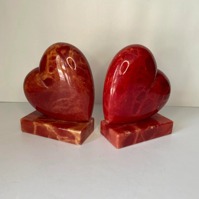 Pair of vintage Italian red alabaster bookends in the shape of a puffy heart.