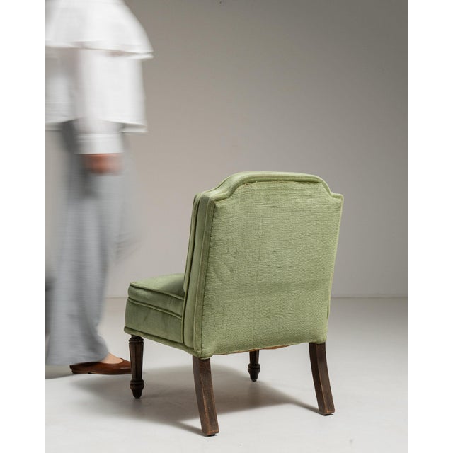 Here is a upholstered piece, its sage green woven texture the first thing to catch the eye. Originating in France during...