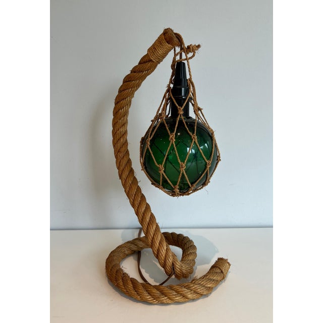 This beautiful table lamp is made of rope with a green glass bowl. It is a French work by Adrien Audoux and Frida Minet...