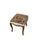 Charming Louis XV style footstool featuring an elegantly carved wooden frame and richly detailed needlepoint upholstery....