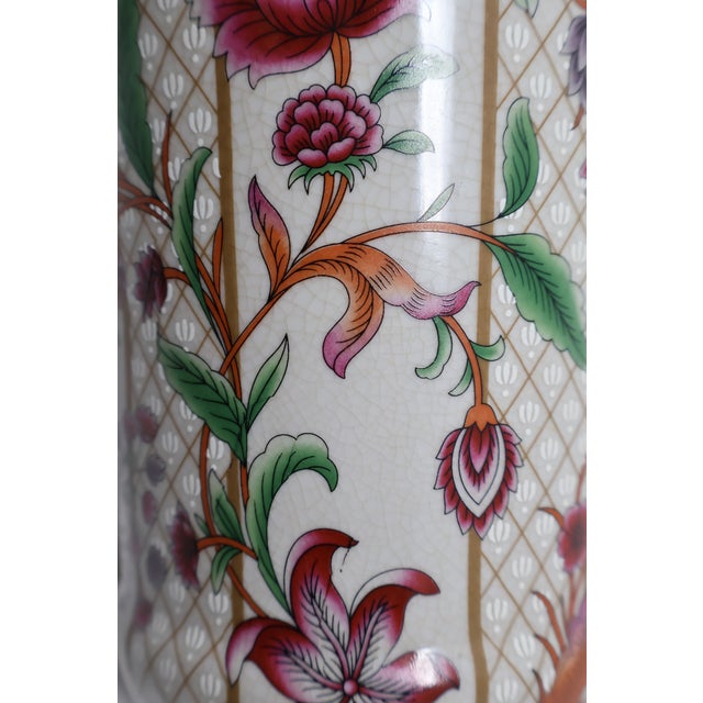 Rich botanical color and finely patterned detail give this Chinese porcelain vase a distinctive presence. Burgundy-pink...