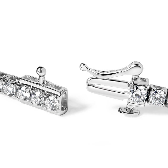 Elegant and timeless, this gorgeous 14 karat white gold tennis bracelet features 3.0 carat total weight of lab grown round...