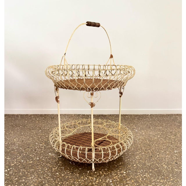Nice authentic French, two-tier metal (wire) and cane bar caddy. Curled wire around the two cane tops make this a...
