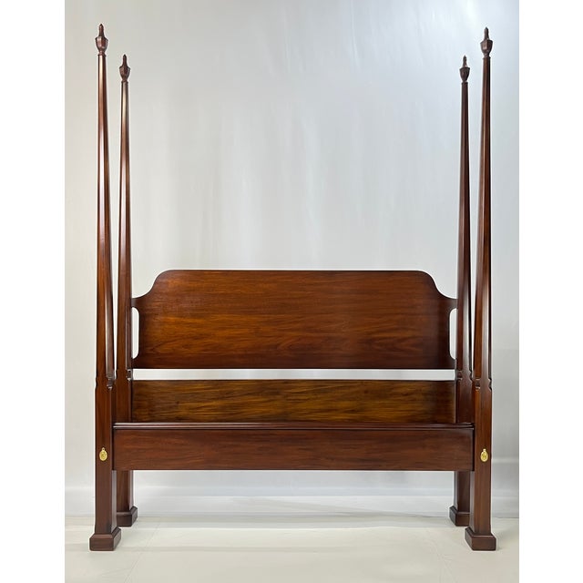 An exceptional Queen-size mahogany four-post pencil bed crafted by the renowned Henkel Harris Co. of Winchester, Virginia....