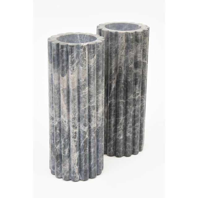 These ribbed Italian column vases are in tones of light to dark gray with white veining. Sold as a pair. Great for...