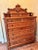 Eastlake lock side chest of drawers, circa 1870. The chest having a carved & spindled gallery surmounted with a pair of...